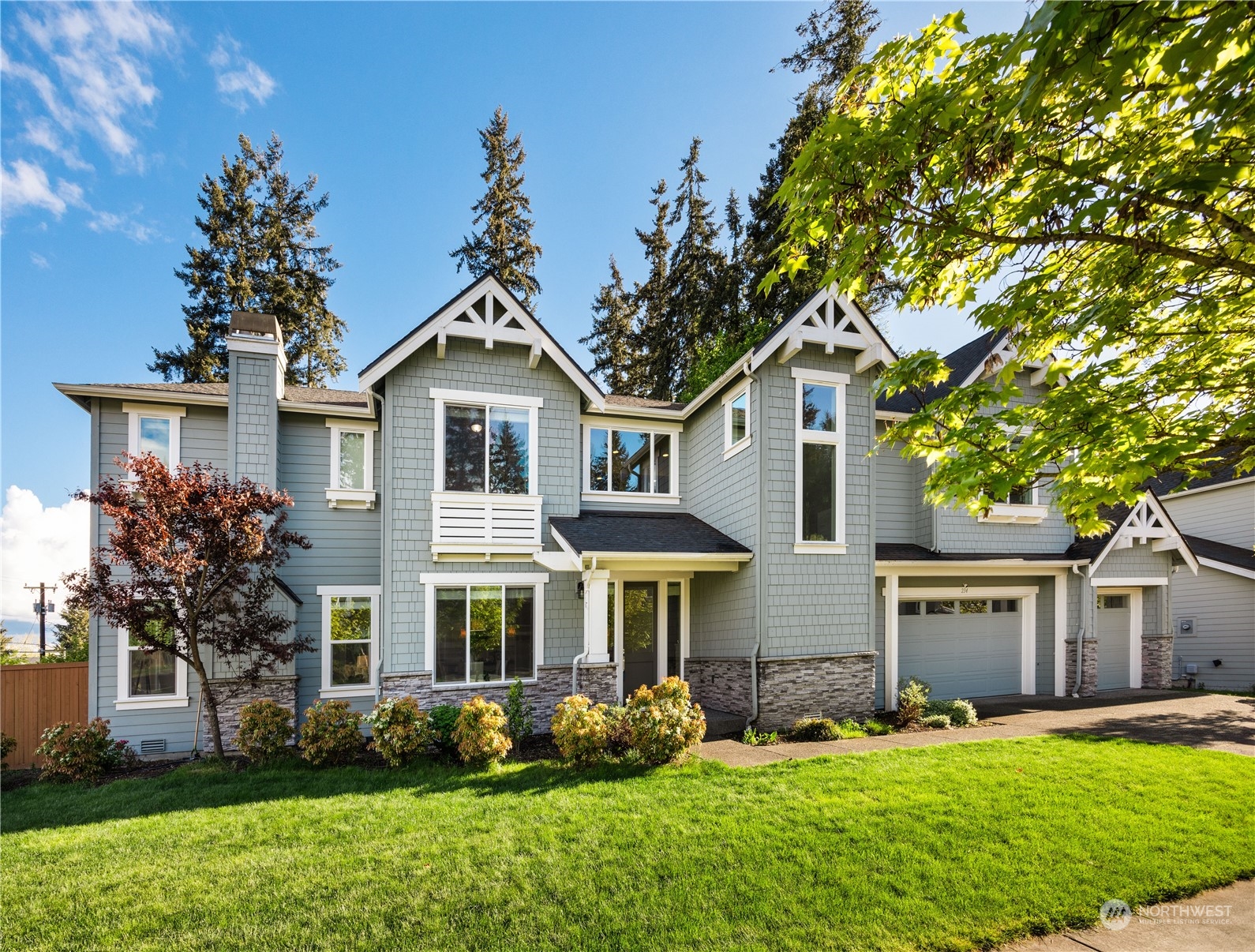 234 239th Street Southeast Bothell, WA 98021 - Photo 2 of 38 a front view of a house with garden