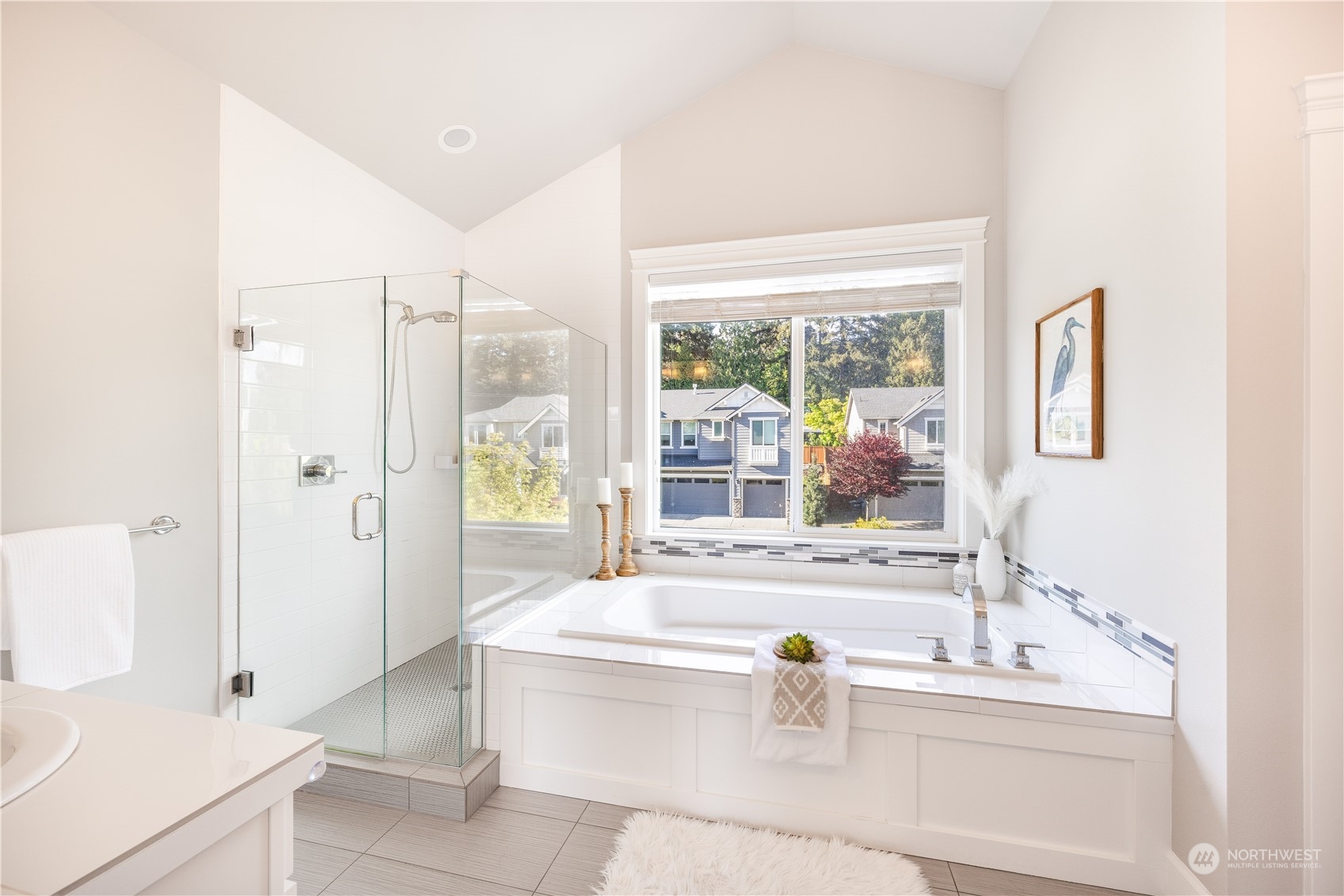 234 239th Street Southeast Bothell, WA 98021 - Photo 22 of 38 a bathroom with a tub a sink and a large mirror