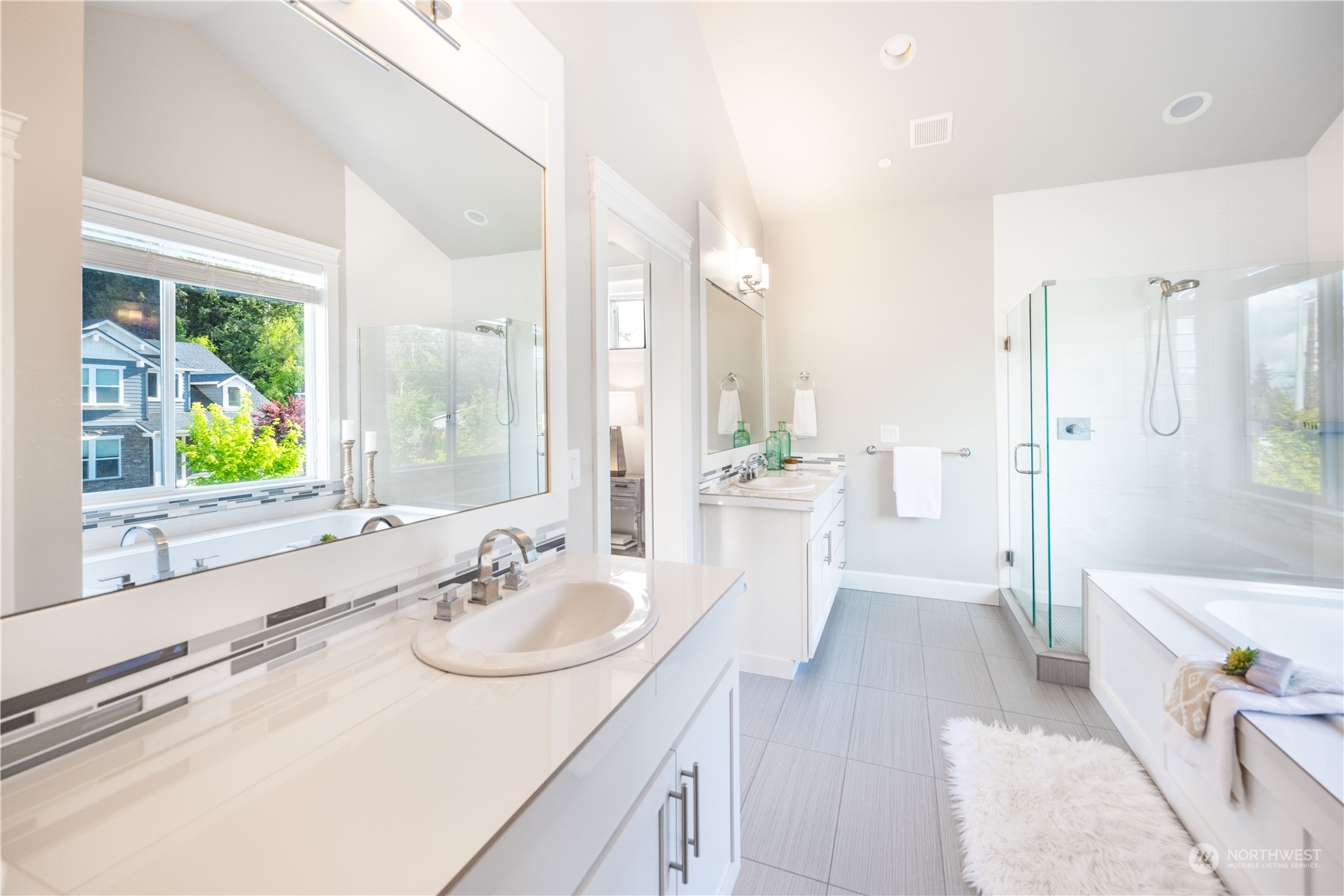 234 239th Street Southeast Bothell, WA 98021 - Photo 23 of 38 a bathroom with a sink a tub and a mirror