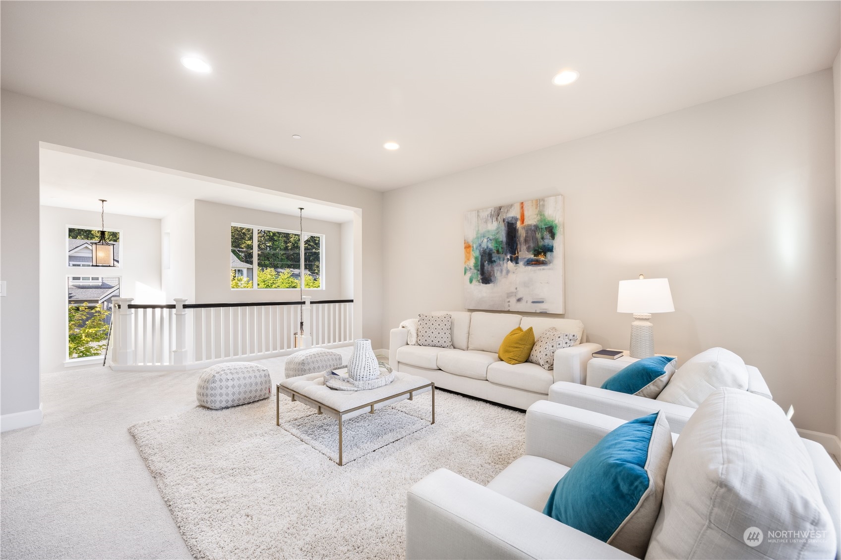 234 239th Street Southeast Bothell, WA 98021 - Photo 25 of 38 a living room with furniture and a wooden floor