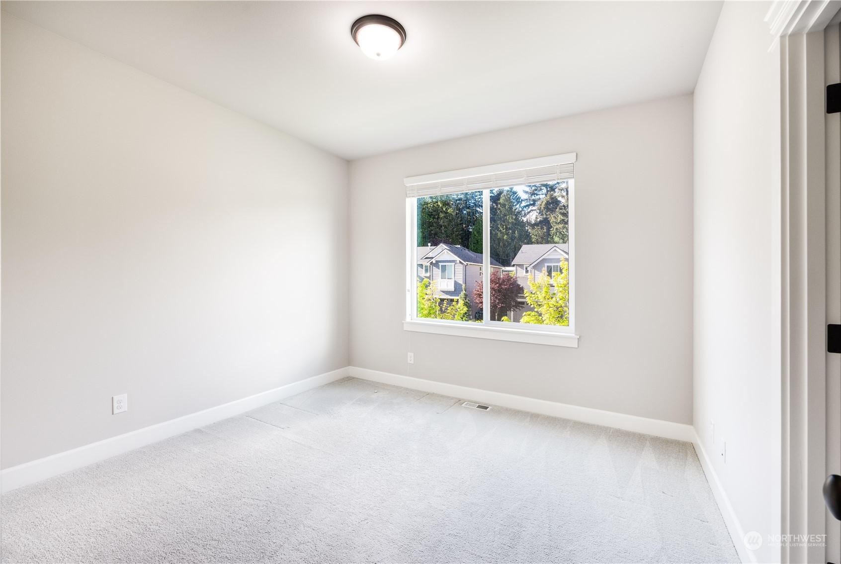234 239th Street Southeast Bothell, WA 98021 - Photo 33 of 38 an empty room with windows