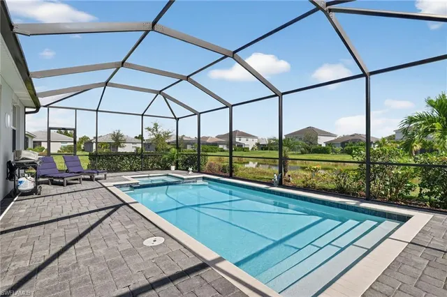 a view of a patio with a table and chairs