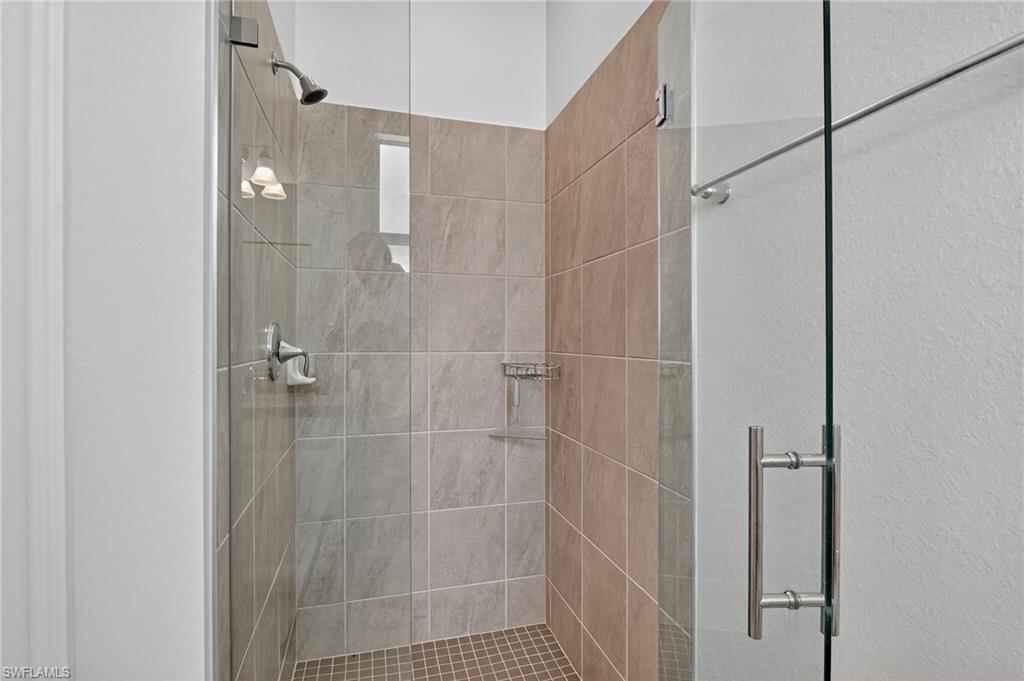 2130 Hamlin Street Naples, FL 34120 - Photo 19 of 40 a bathroom with a shower