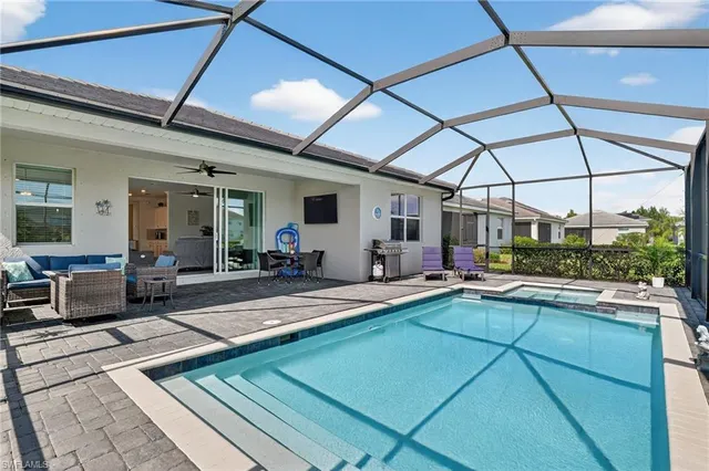 a living room with lots of furniture and a table