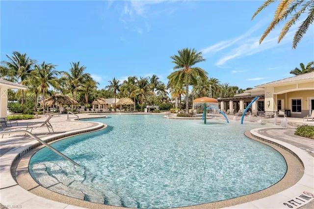 a view of a swimming pool with a yard