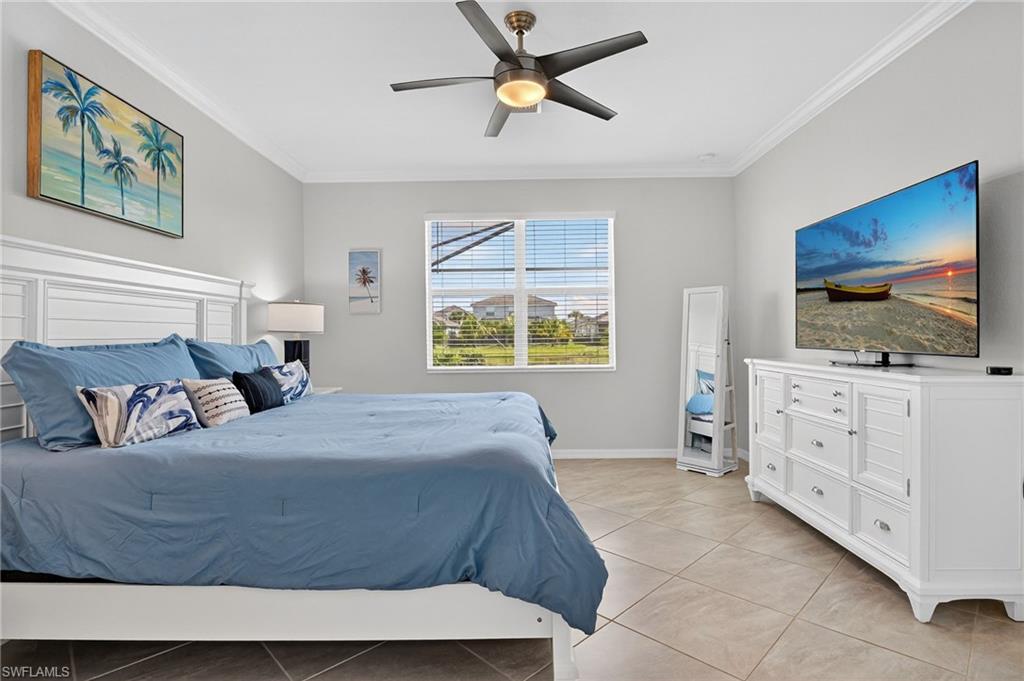 2130 Hamlin Street Naples, FL 34120 - Photo 10 of 40 a living room with furniture and a flat screen tv