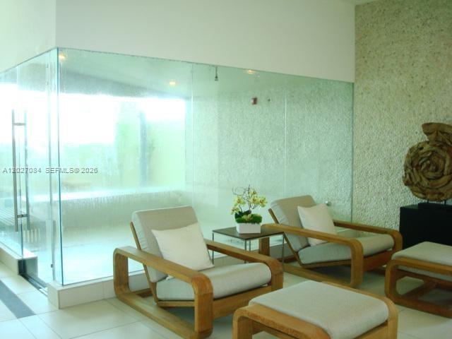 92 Southwest 3rd Street, Unit 1803 Miami, FL 33130 - Photo 27 of 29 a living room with furniture and a window