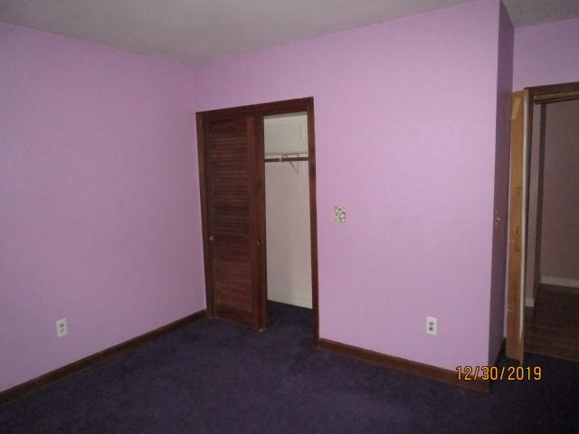 175 Woodside Road, Unit W00 West Barnstable, MA 02668 - Photo 6 of 22 a view of an empty room with wooden floor and a window