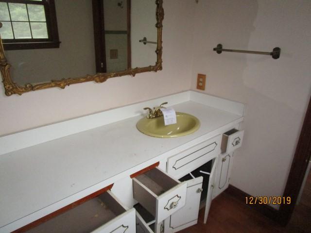 175 Woodside Road, Unit W00 West Barnstable, MA 02668 - Photo 8 of 22 a bathroom with a sink a toilet and vanity