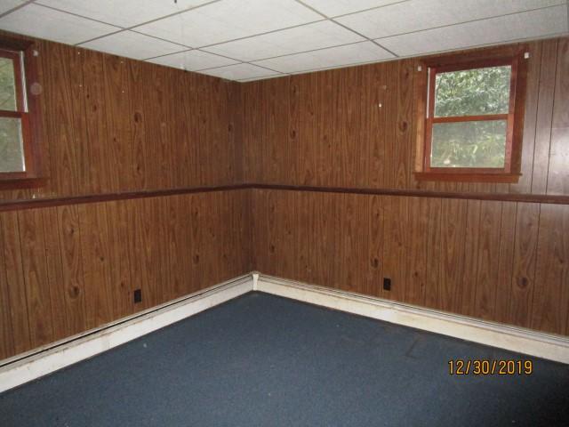 175 Woodside Road, Unit W00 West Barnstable, MA 02668 - Photo 10 of 22 an empty room with a wooden door
