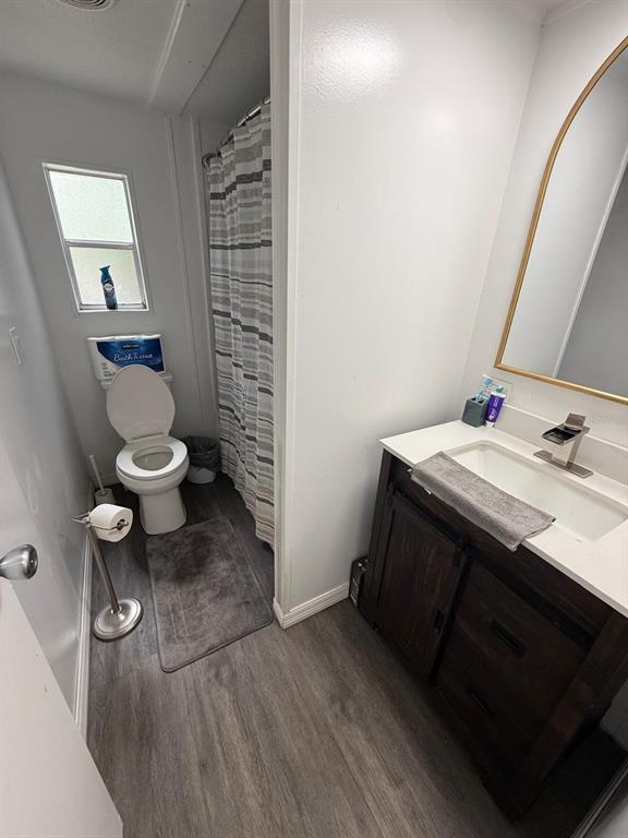 2433 East North Street Inverness, FL 34453 - Photo 6 of 11 a bathroom with a sink and a toilet