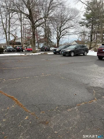 a view of road with a parked cars