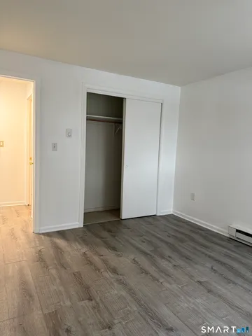 an empty room with wooden door