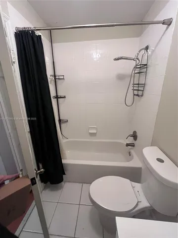 a bathroom with a toilet a sink and a shower