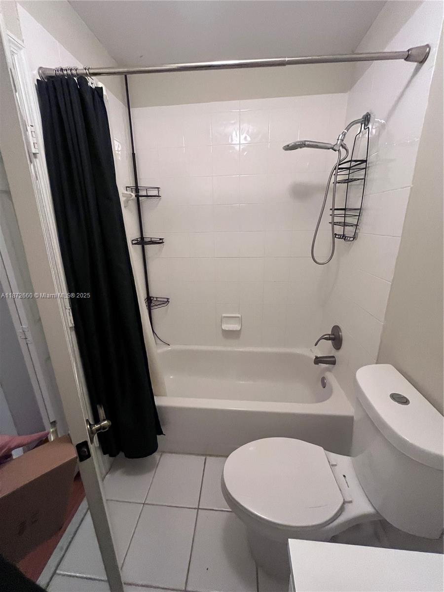 2320 Southeast 23rd Road, Unit 2320 Homestead, FL 33035 - Photo 13 of 20 a bathroom with a toilet a sink and a shower