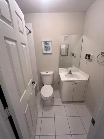 a view of a bathroom with a sink and mirror