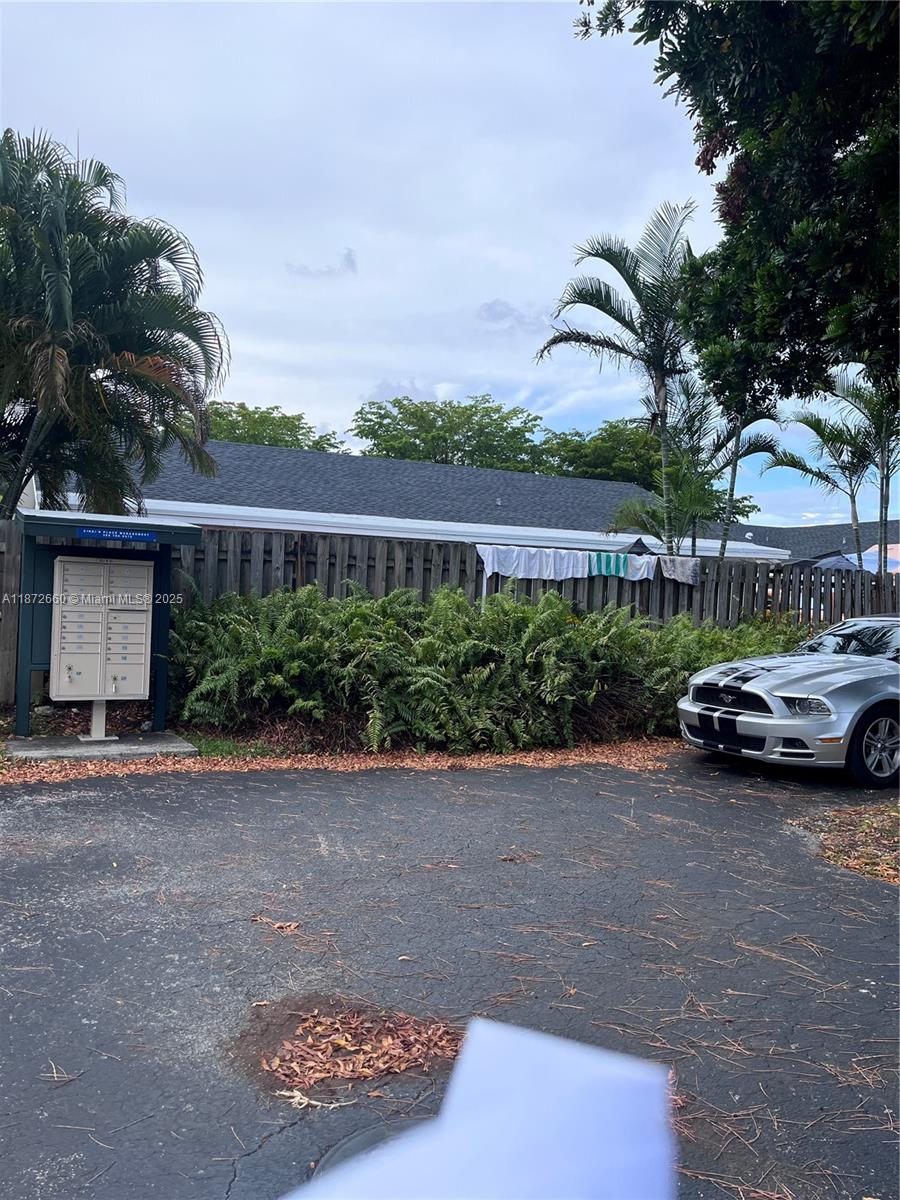 2320 Southeast 23rd Road, Unit 2320 Homestead, FL 33035 - Photo 19 of 20 a view of street with parked cars