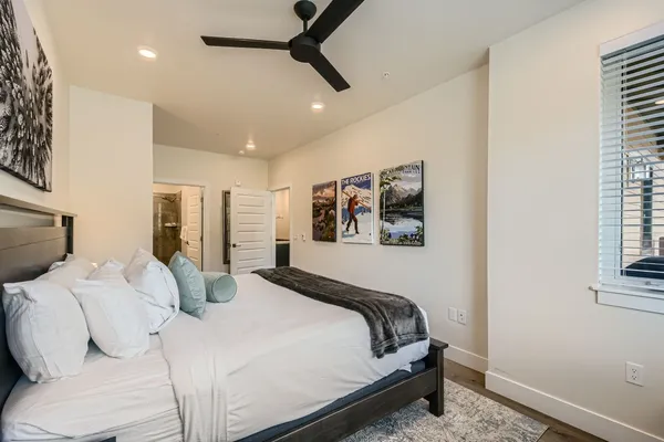 a bedroom with a large bed and a window