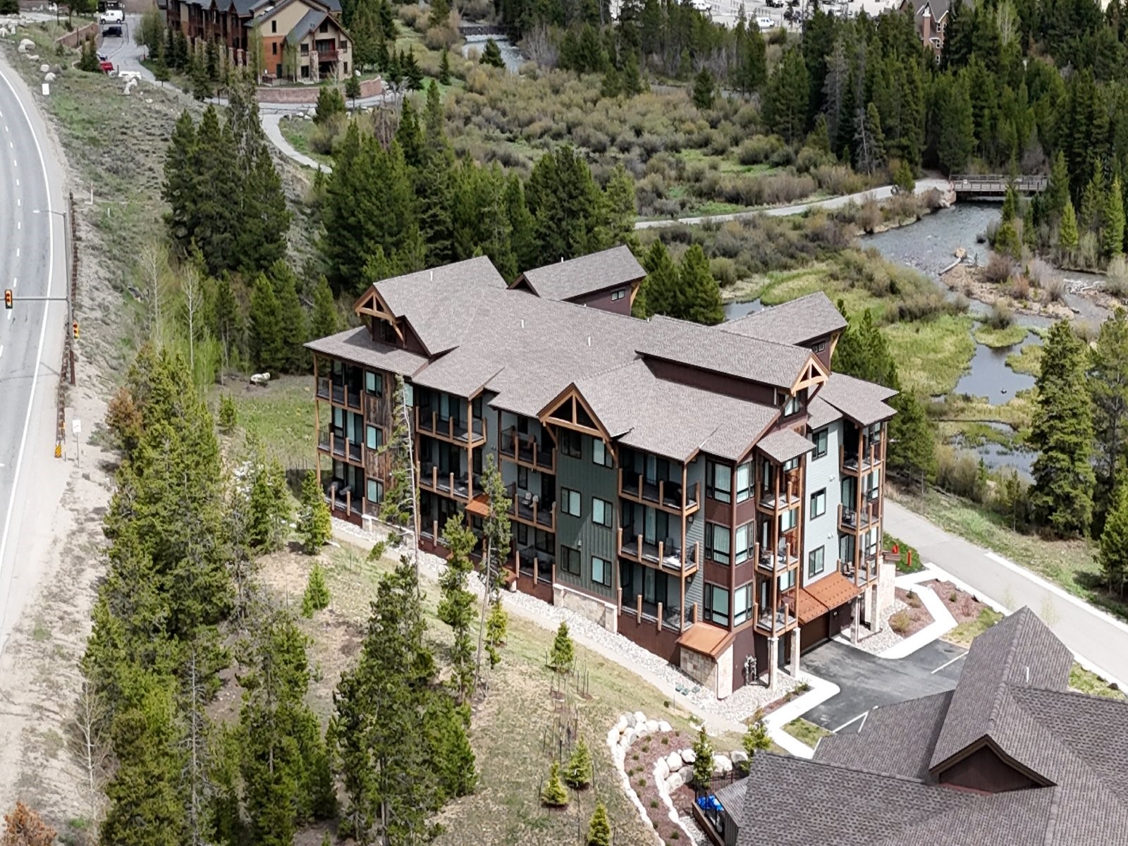 75 Clearwater Way, Unit 302 Keystone, CO 80435 - Photo 29 of 36 an aerial view of a house with yard porch and mountain view in back