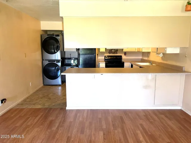 a view of a living room with a washer and dryer