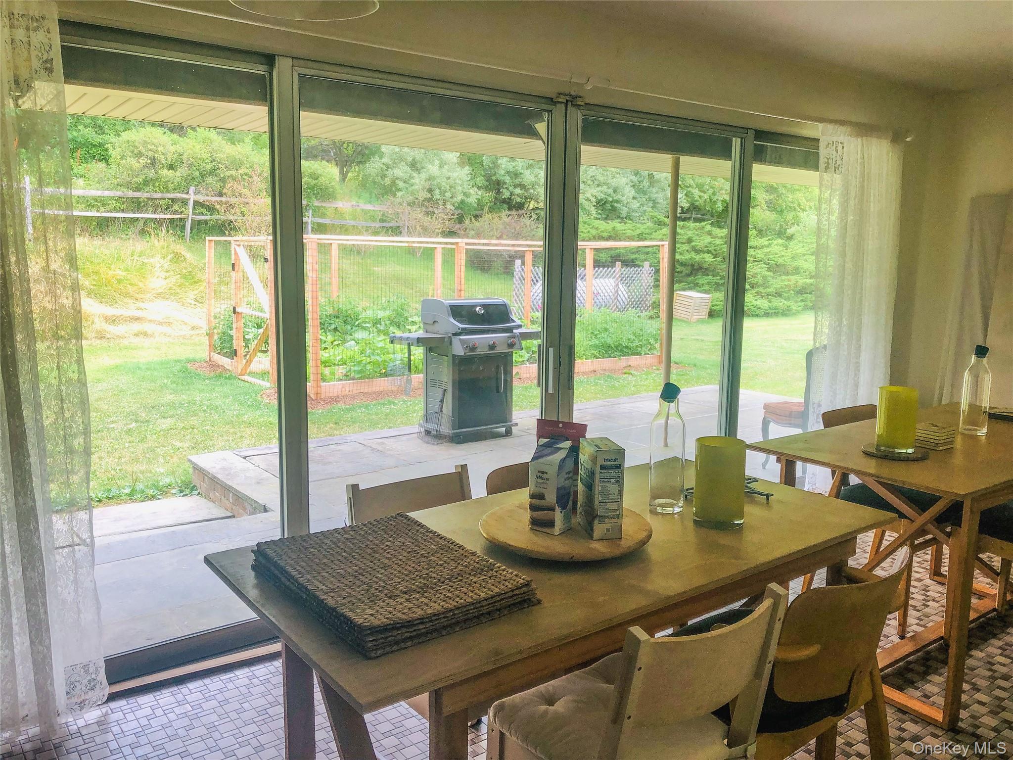 68-78 Ridge Road Clinton Corners, NY 12514 - Photo 20 of 50 a view of a dining table and chairs in porch