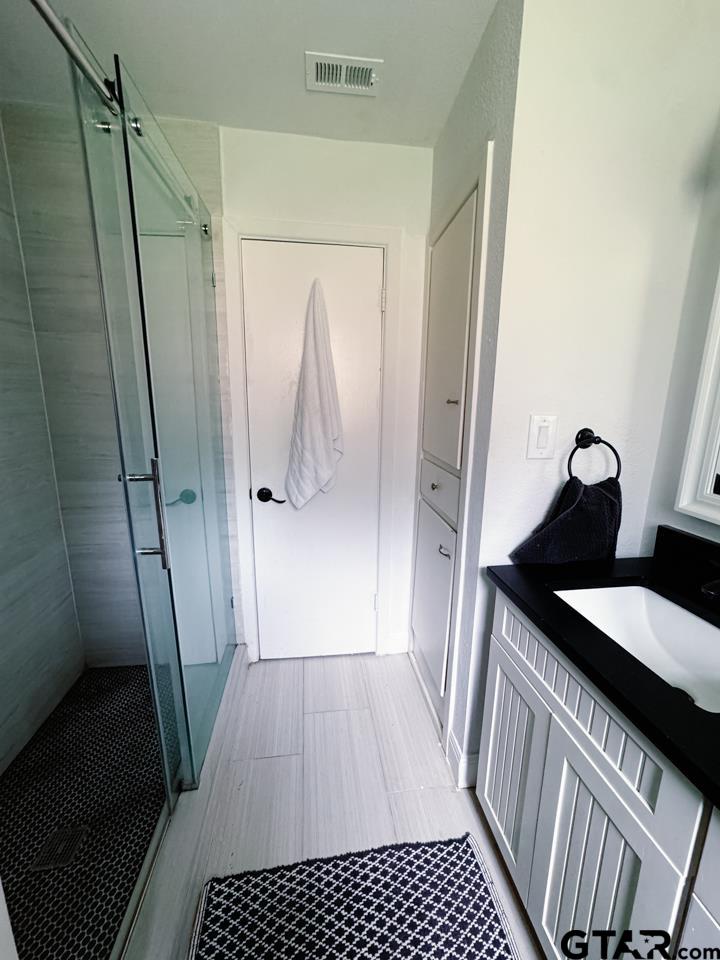 2411 Rodge Drive Tyler, TX 75701 - Photo 21 of 42 a view of a bathroom from the hallway
