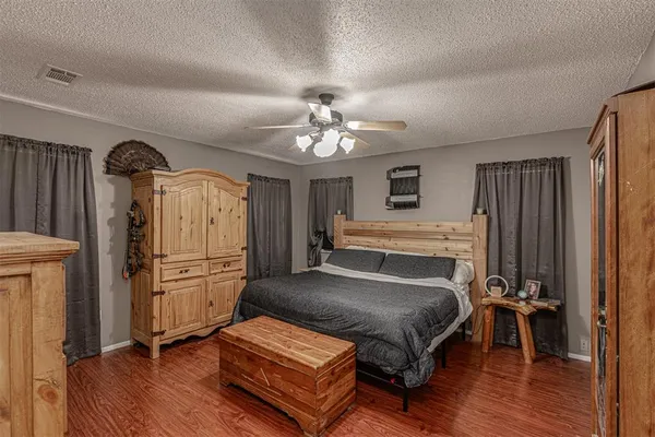 a bedroom with furniture and a window