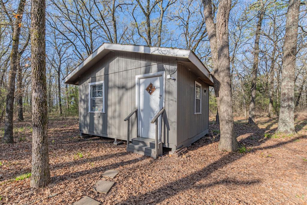201 County Road 1399 Point, TX 75472 - Photo 24 of 39 Shed with 100 amp sub panel, has two 220v plugs one with A/C plugged into few 110v plugs as well. shed is insulated.