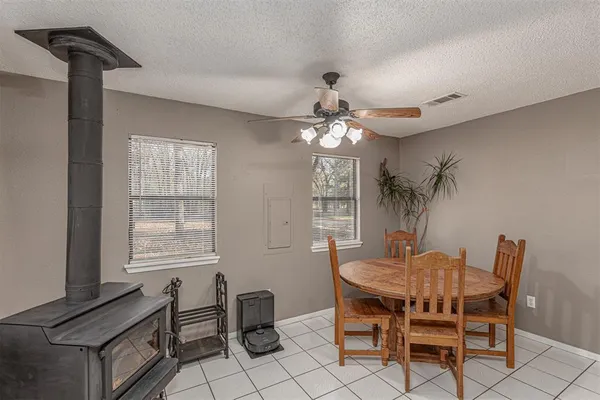 a dining room with furniture and window