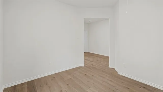 a kitchen with a sink and a mirror