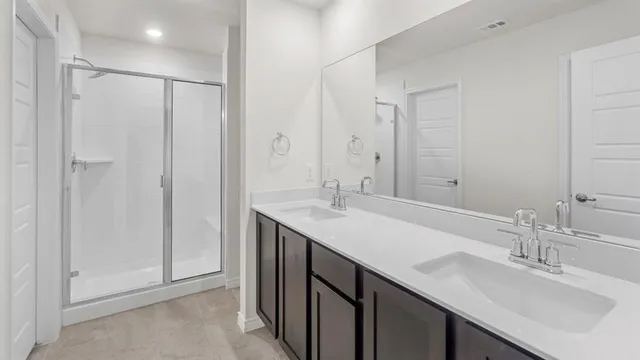 a bathroom with a double vanity sink mirror and double