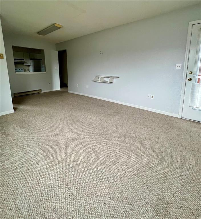 60 Davos Pointe, Unit B8 Woodridge, NY 12789 - Photo 2 of 6 a view of an empty room with a fireplace