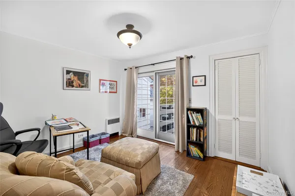 a bedroom with furniture and a window