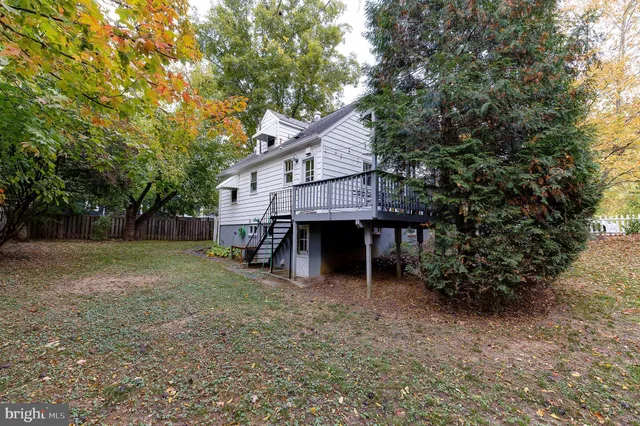 a house that has a tree in front of it