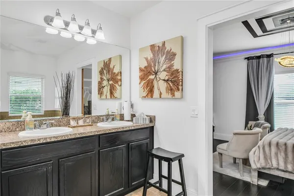 a view of a house with a yard and sitting area