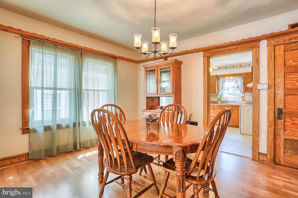 306 East New Street Lititz, PA 17543 - Photo 16 of 31 a dining room with furniture a chandelier and wooden floor