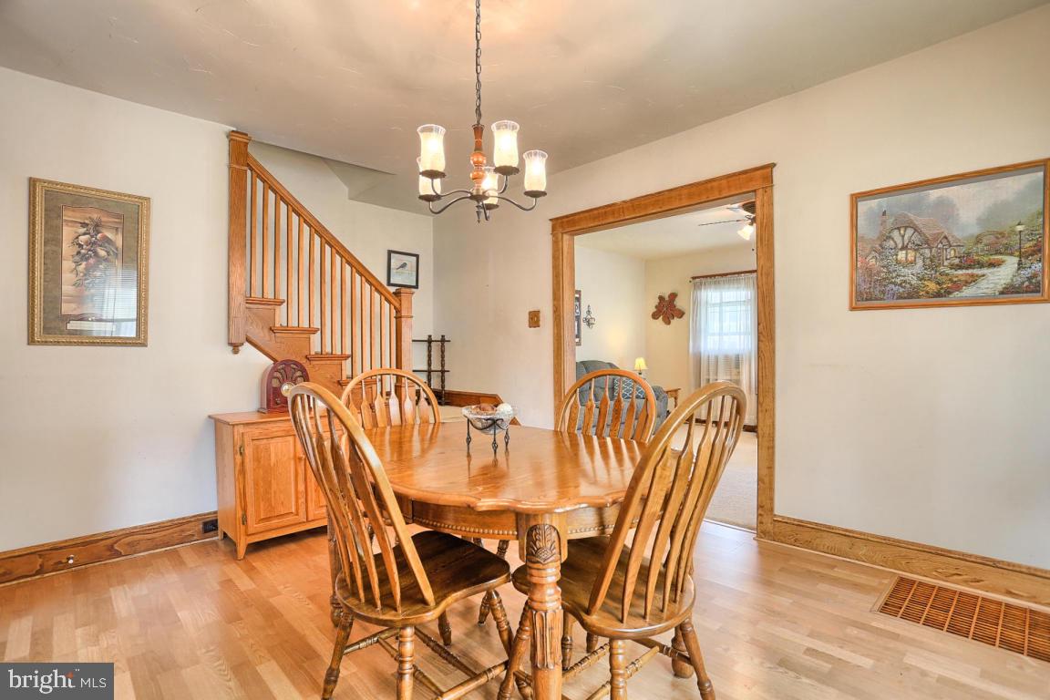 306 East New Street Lititz, PA 17543 - Photo 18 of 31 a view of a dining room with furniture wooden floor and a chandelier