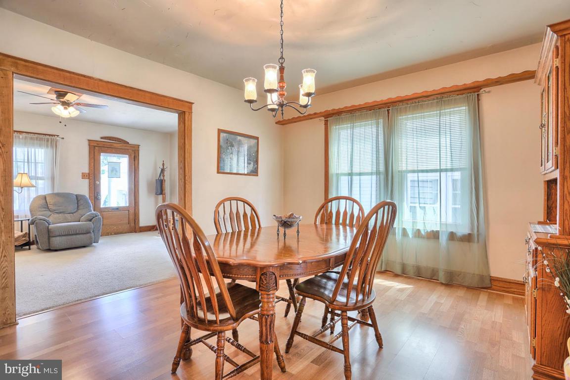 306 East New Street Lititz, PA 17543 - Photo 19 of 31 a view of a dining room with furniture window and wooden floor