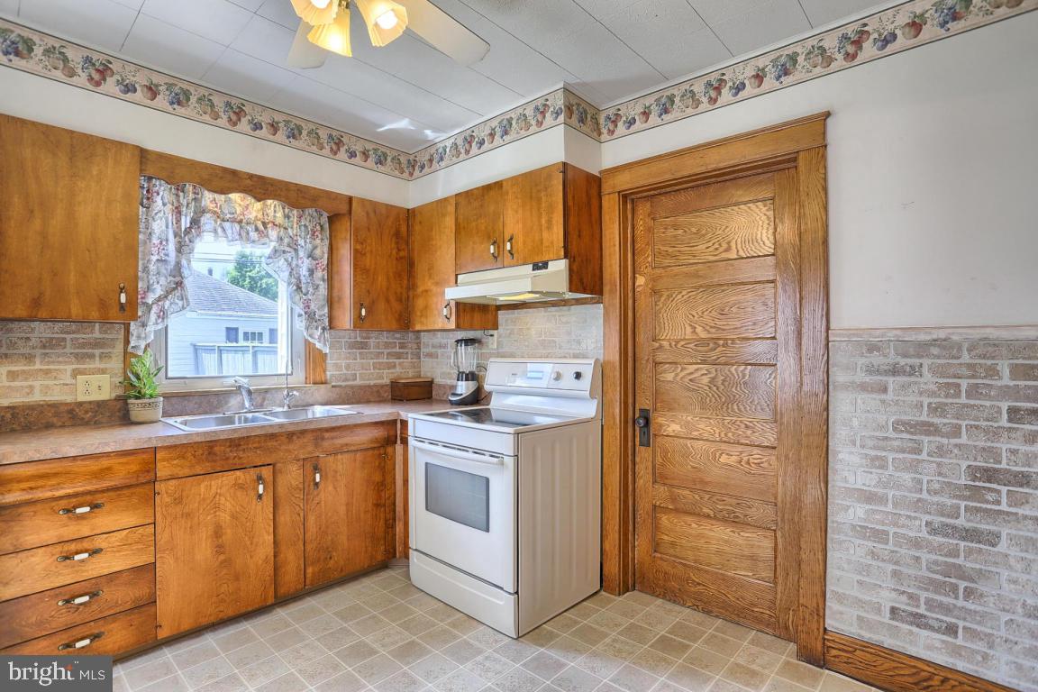 306 East New Street Lititz, PA 17543 - Photo 21 of 31 a kitchen with a sink stove and cabinets
