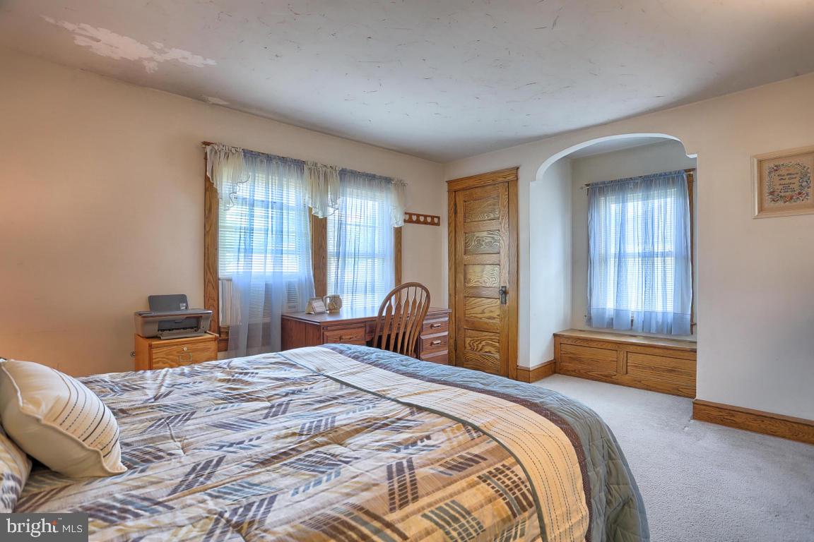 306 East New Street Lititz, PA 17543 - Photo 28 of 31 a bedroom with a bed and a dresser next to a window