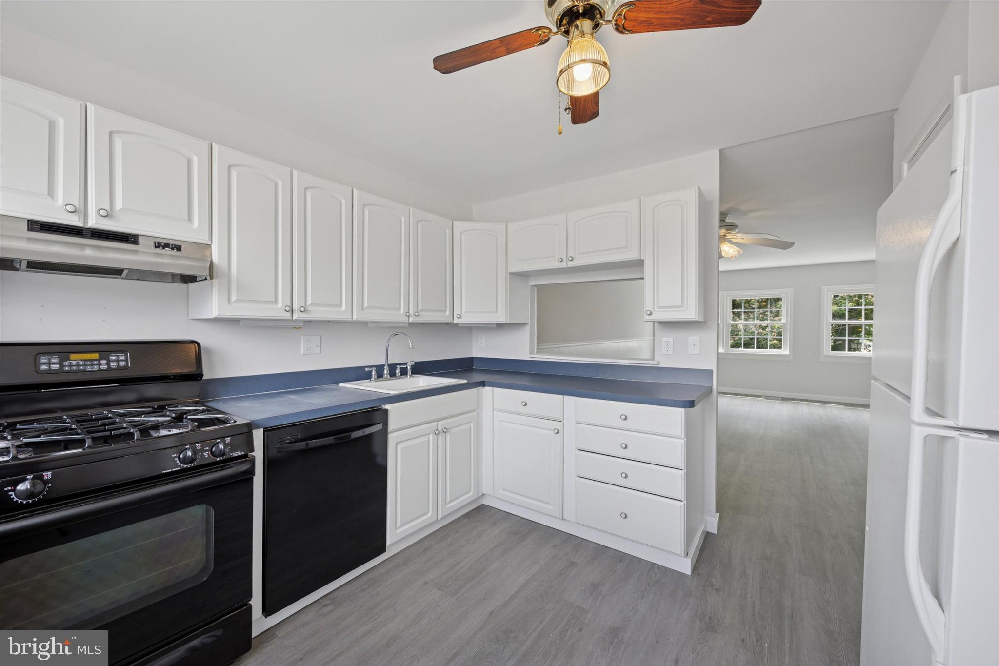 12136 Sweet Briar Road Philadelphia, PA 19154 - Photo 12 of 33 a kitchen with granite countertop cabinets stainless steel appliances and a counter space