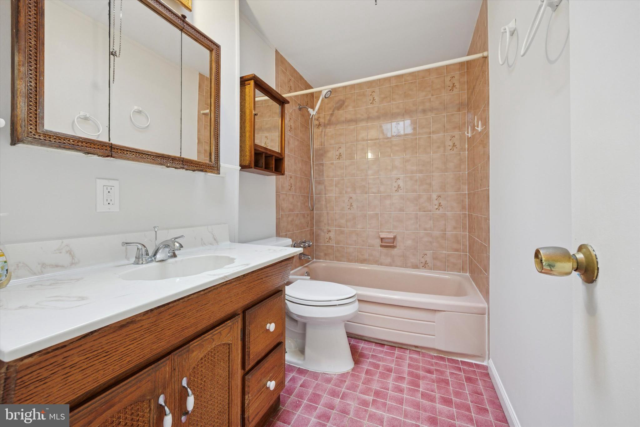 12136 Sweet Briar Road Philadelphia, PA 19154 - Photo 14 of 33 a bathroom with a sink a toilet and shower