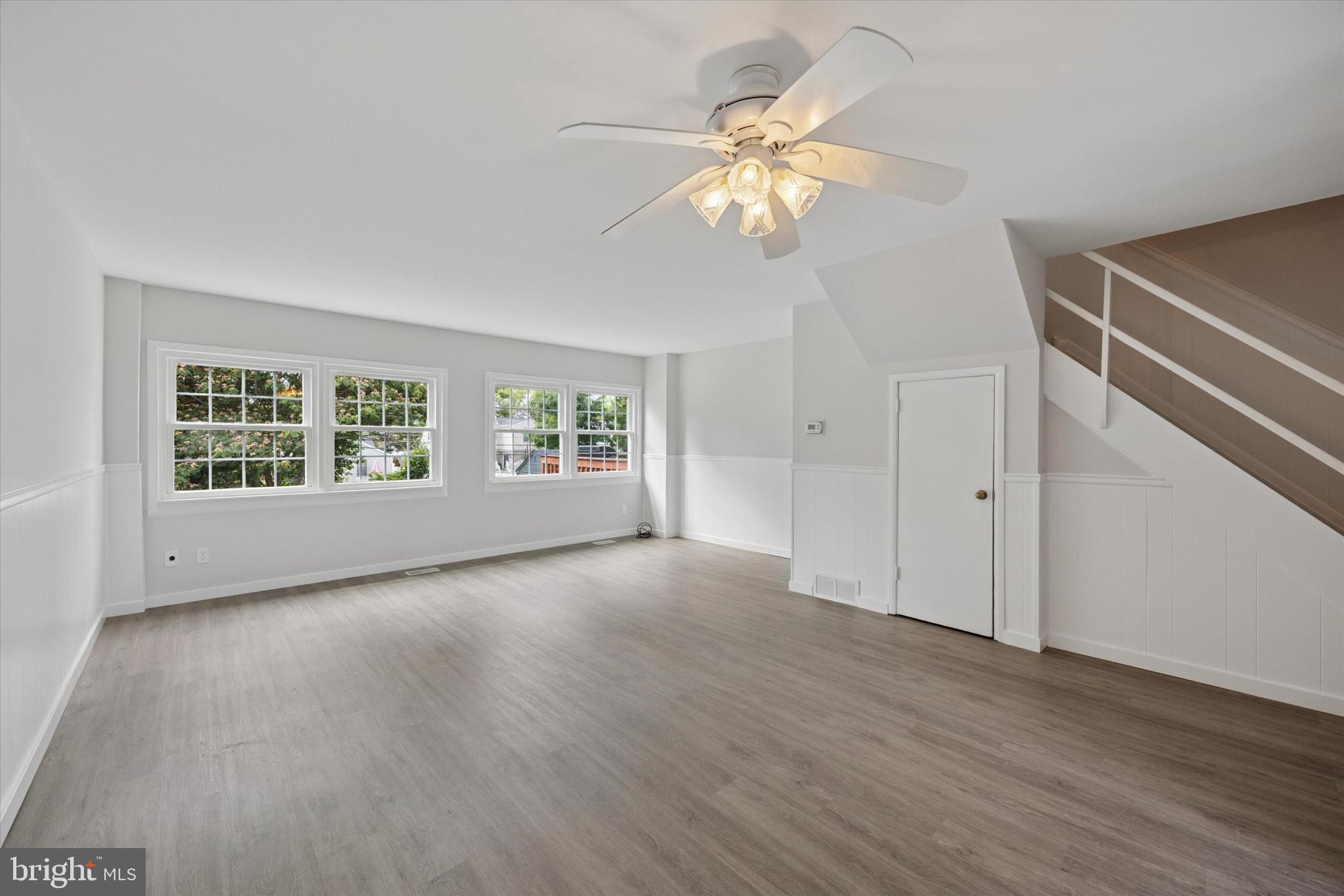 12136 Sweet Briar Road Philadelphia, PA 19154 - Photo 5 of 33 a view of an empty room with a window and wooden floor