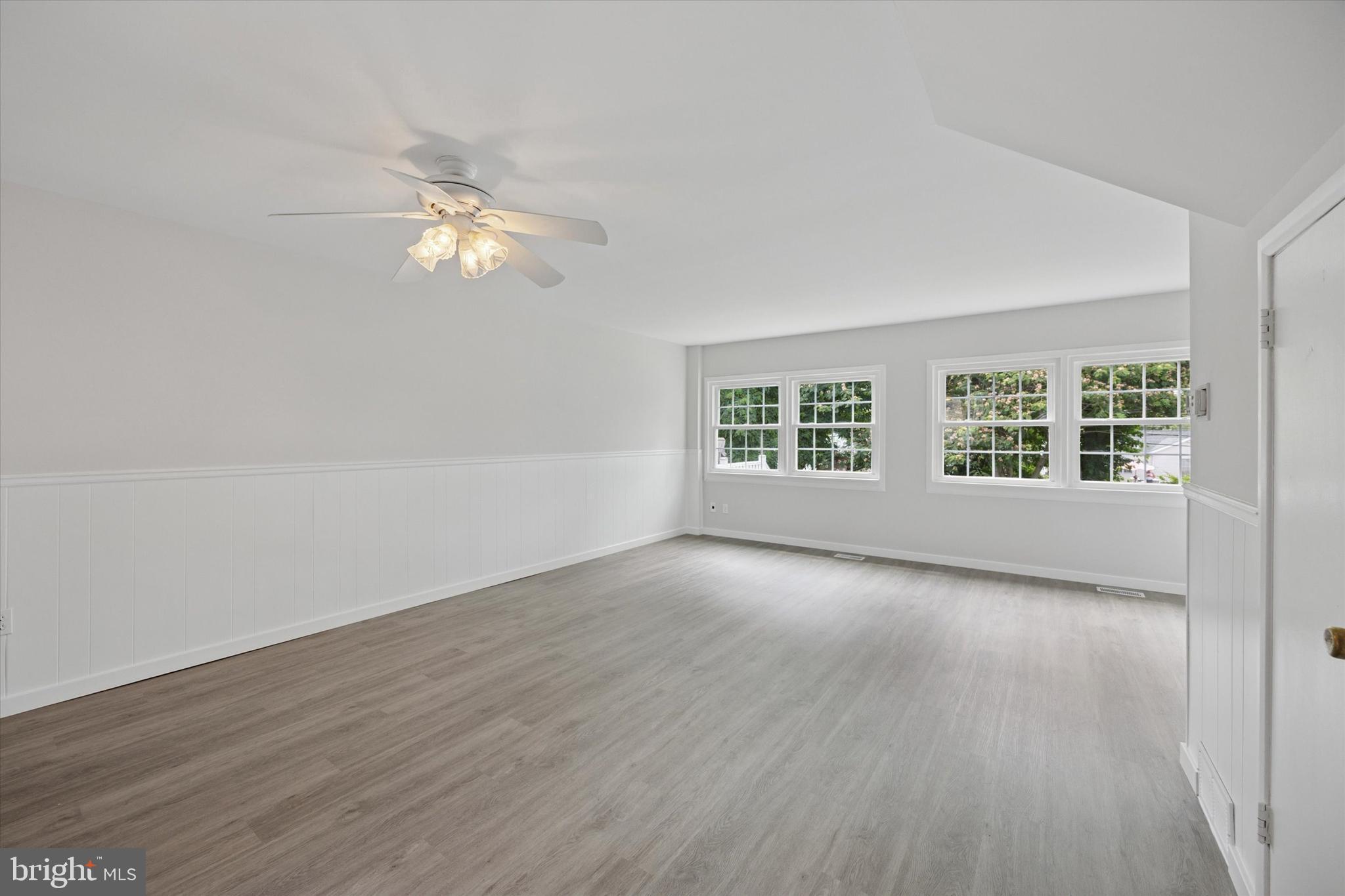 12136 Sweet Briar Road Philadelphia, PA 19154 - Photo 6 of 33 wooden floor in an empty room with a window