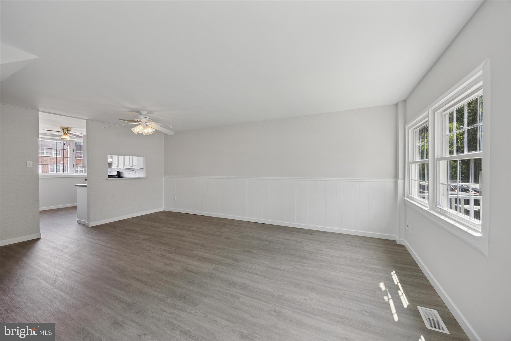 12136 Sweet Briar Road Philadelphia, PA 19154 - Photo 9 of 33 wooden floor in an empty room with a window