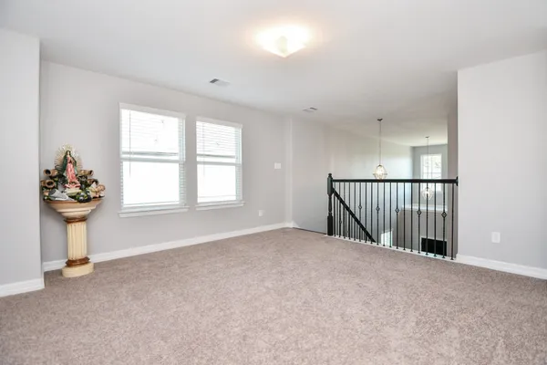 a view of a hallway with a window