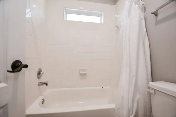 a bathroom with a shower curtain
