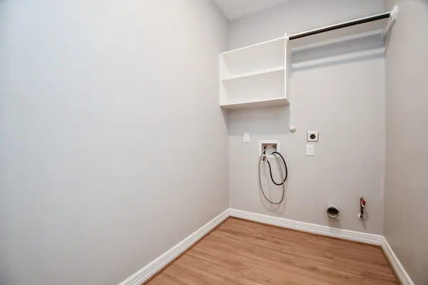 a bathroom with a glass shower door with a shower