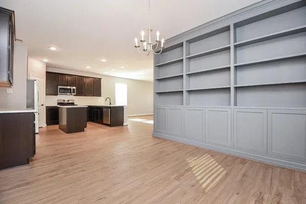 a view of kitchen with cabinets and wooden floor