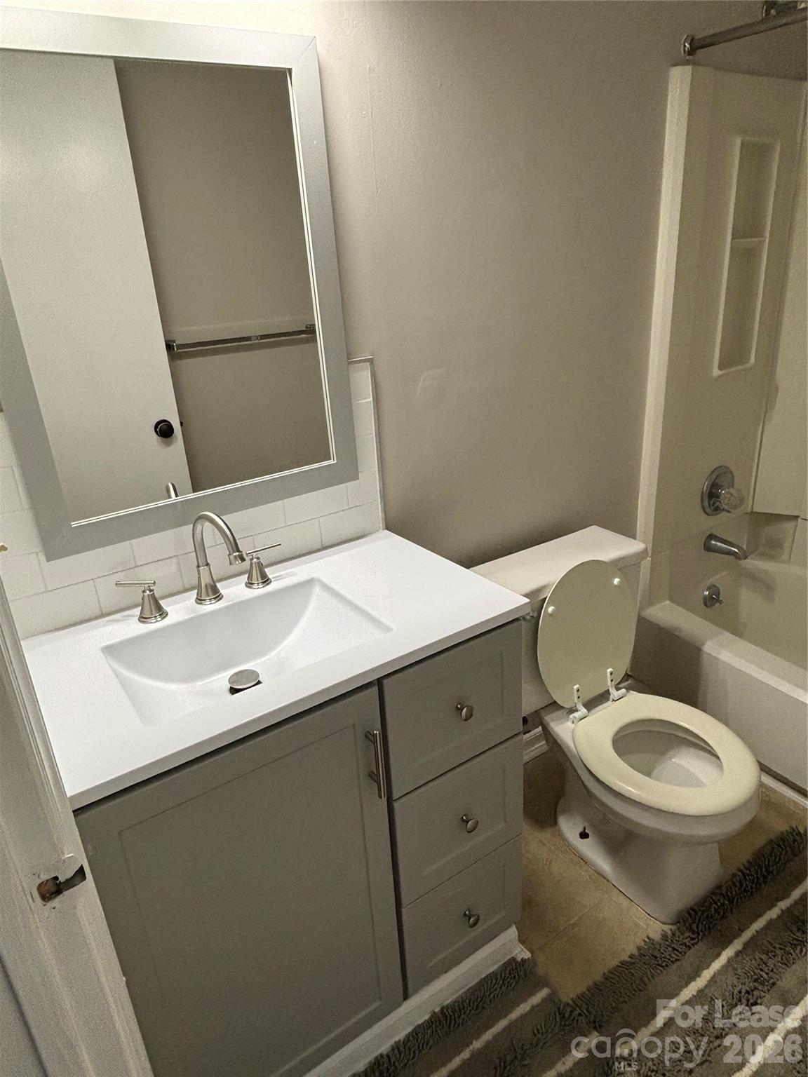 11040 Harrowfield Road Charlotte, NC 28226 - Photo 13 of 14 a bathroom with a sink and a mirror